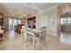 Well lit dining area near kitchen, with a wooden table and chairs at 13463 Nobilio St, Venice, FL 34293