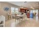 Charming dining area adjacent to kitchen, featuring a farmhouse table and chairs at 13463 Nobilio St, Venice, FL 34293