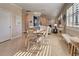 Light and airy dining area with a view into the living room and kitchen at 13463 Nobilio St, Venice, FL 34293