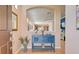 Entryway with blue console table and view into living room at 13463 Nobilio St, Venice, FL 34293