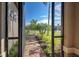 View through screened porch to walkway and neighborhood at 13463 Nobilio St, Venice, FL 34293