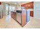 Island kitchen with stainless steel appliances and granite countertops at 13463 Nobilio St, Venice, FL 34293