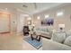 Living room with light beige sofa and blue patterned rug at 13463 Nobilio St, Venice, FL 34293