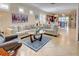 Living room with view into kitchen and dining area at 13463 Nobilio St, Venice, FL 34293