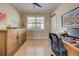 Home office with built-in wooden cabinet and desk at 13463 Nobilio St, Venice, FL 34293