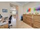 Bright home office with view to adjacent living area at 13463 Nobilio St, Venice, FL 34293