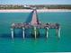 Aerial view of a pier extending into ocean at 13463 Nobilio St, Venice, FL 34293