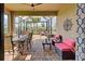 This screened patio features dining and seating areas at 13463 Nobilio St, Venice, FL 34293