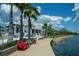 Lakeside boardwalk with red chairs and benches at 13463 Nobilio St, Venice, FL 34293