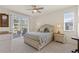 Bright bedroom featuring a ceiling fan, sliding glass doors, and a view to the patio at 1537 Monarch Dr, Venice, FL 34293