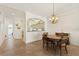 Inviting dining area with a view into the well-appointed kitchen at 1537 Monarch Dr, Venice, FL 34293