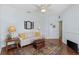 Comfortable living room with a neutral sofa, area rug, and an accent table at 1537 Monarch Dr, Venice, FL 34293