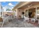 Covered patio shows ample seating space, barbecue, and an outdoor ceiling fan at 1537 Monarch Dr, Venice, FL 34293