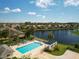 Community pool and gazebo overlook a tranquil lake in this attractive residential neighborhood at 1537 Monarch Dr, Venice, FL 34293