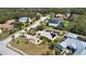 Aerial view of a home with solar panels and a well-maintained community at 15804 29Th E St, Parrish, FL 34219