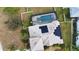 An aerial view shows a screened pool and solar panels on the roof of this well-maintained home at 15804 29Th E St, Parrish, FL 34219