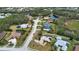 An aerial view shows a neighborhood lined with trees, homes, and ponds at 15804 29Th E St, Parrish, FL 34219