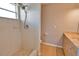 Bathroom showcasing a tile shower with adjustable shower head and a vanity at 15804 29Th E St, Parrish, FL 34219