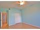 Bright bedroom with wood floors, closet, and door leading to another room at 15804 29Th E St, Parrish, FL 34219