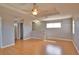 Bonus room with wood-look floors, ceiling fan, and window offering natural light at 15804 29Th E St, Parrish, FL 34219