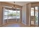 Bright breakfast nook with bay window, chandelier, pool view and access to the outdoor patio at 15804 29Th E St, Parrish, FL 34219