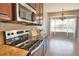 Breakfast nook adjacent to the kitchen, featuring stainless steel appliances and bright natural light at 15804 29Th E St, Parrish, FL 34219