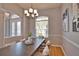 Dining room featuring a modern chandelier and seating for six people at 15804 29Th E St, Parrish, FL 34219