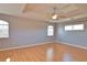 Empty main bedroom with laminate flooring, a ceiling fan, and natural light at 15804 29Th E St, Parrish, FL 34219