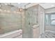 Elegant walk-in shower in an updated bathroom featuring sleek glass doors and tiled walls at 1600 Lilliput Ct, Venice, FL 34293