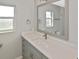 Bright bathroom featuring a large mirror, modern vanity, and sleek fixtures at 1600 Lilliput Ct, Venice, FL 34293