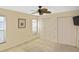 Bedroom with double closets, carpet, and a ceiling fan at 1600 Lilliput Ct, Venice, FL 34293