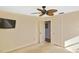 Bedroom with ceiling fan and TV at 1600 Lilliput Ct, Venice, FL 34293