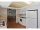 View of kitchen leading to the dining room, maximizing space at 1600 Lilliput Ct, Venice, FL 34293