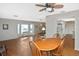 Bright living room featuring terra-cotta tile and a ceiling fan for added comfort at 1600 Lilliput Ct, Venice, FL 34293