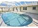 A refreshing private pool inside of a screened enclosure, perfect for enjoying the outdoors at 1600 Lilliput Ct, Venice, FL 34293