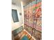 Bathroom featuring a white tub with neutral patterned shower curtain and wood-look flooring at 17 Nautical Dr, North Port, FL 34287