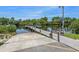 Community boat ramp featuring a wooden dock, signage, and concrete launch area, ideal for boating enthusiasts at 17 Nautical Dr, North Port, FL 34287