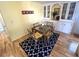 Dining Area featuring table, chairs, overhead hutch and hardwood floors at 17 Nautical Dr, North Port, FL 34287