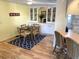 Dining Area featuring table, chairs, overhead hutch and hardwood floors at 17 Nautical Dr, North Port, FL 34287