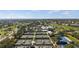 Aerial view of the community showcasing tennis courts, golf course and lush landscapes at 174 Southampton S Pl # 345, Venice, FL 34293