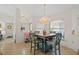 Bright dining area featuring stylish lighting and a window, creating a welcoming atmosphere at 174 Southampton S Pl # 345, Venice, FL 34293