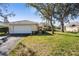 Charming single-story home with a well-maintained lawn and mature landscaping at 174 Southampton S Pl # 345, Venice, FL 34293