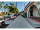 Charming street view with sidewalk and lovely trees, enhanced by nearby businesses at 174 Southampton S Pl # 345, Venice, FL 34293