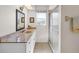 Bathroom featuring a cultured marble vanity top and a glass enclosed walk in shower at 1773 Hudson St, Englewood, FL 34223