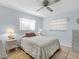 Bedroom with ceiling fan and tile flooring at 1773 Hudson St, Englewood, FL 34223