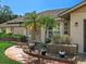 Beautiful landscaping featuring mature plants and manicured brick planters add curb appeal to the front entrance at 1773 Hudson St, Englewood, FL 34223