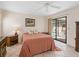 Cozy main bedroom with private access to the pool area at 1773 Hudson St, Englewood, FL 34223