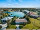 Waterfront home with screened pool and lush landscaping, located on a canal with boat dock and beautiful water views at 18053 Cullman Ave, Port Charlotte, FL 33948