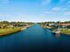 Aerial view showcasing waterfront homes along a tranquil canal at 18053 Cullman Ave, Port Charlotte, FL 33948