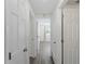 Hallway with multiple doors leading to different rooms at 18053 Cullman Ave, Port Charlotte, FL 33948